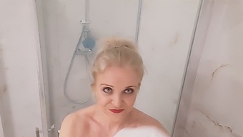 Elderly Blonde With Large Breasts Enjoys A Heated Shower